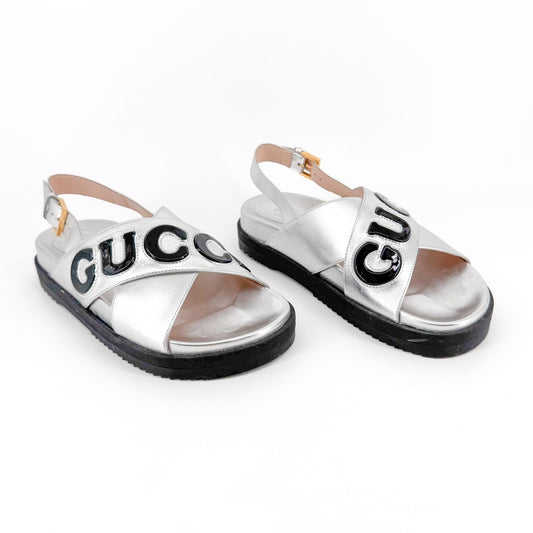 Gucci Ornella Criss-Cross Logo Sandals in Metallic Silver Leather Size 38.5