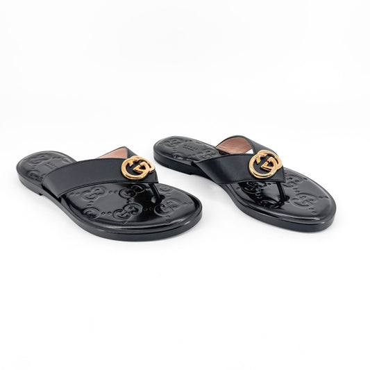 Gucci GG Interlock Embossed Flat Thong Sandals in Black Leather – Size 37