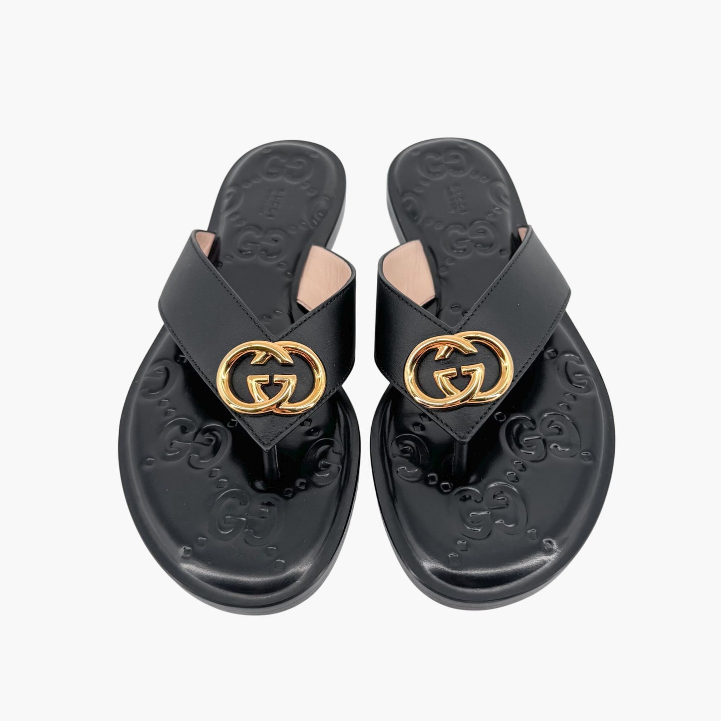 Gucci GG Interlock Embossed Flat Thong Sandals in Black Leather – Size 37