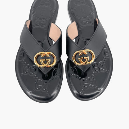 Gucci GG Interlock Embossed Flat Thong Sandals in Black Leather – Size 37