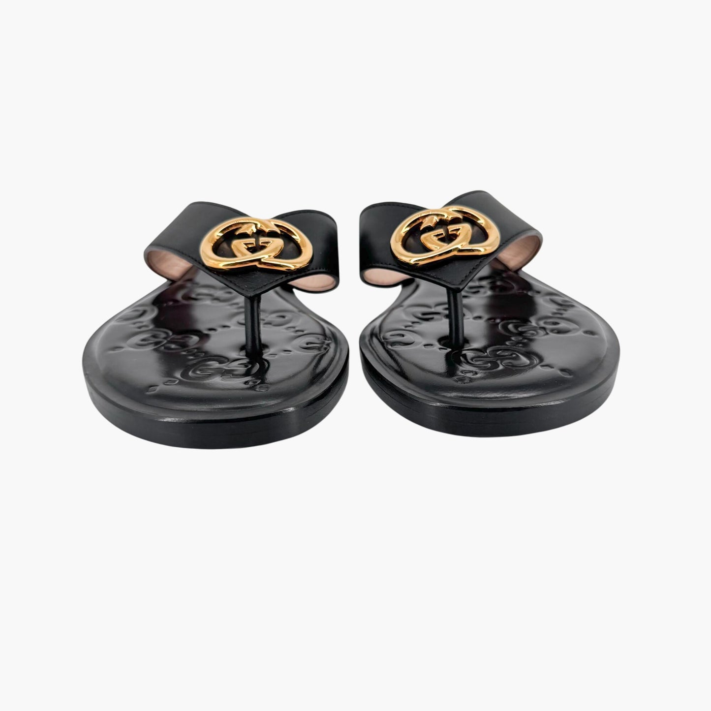 Gucci GG Interlock Embossed Flat Thong Sandals in Black Leather – Size 37