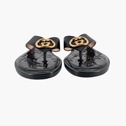 Gucci GG Interlock Embossed Flat Thong Sandals in Black Leather – Size 37
